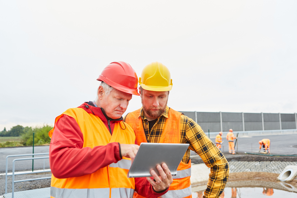 Construction Manager and Construction Worker on the Construction