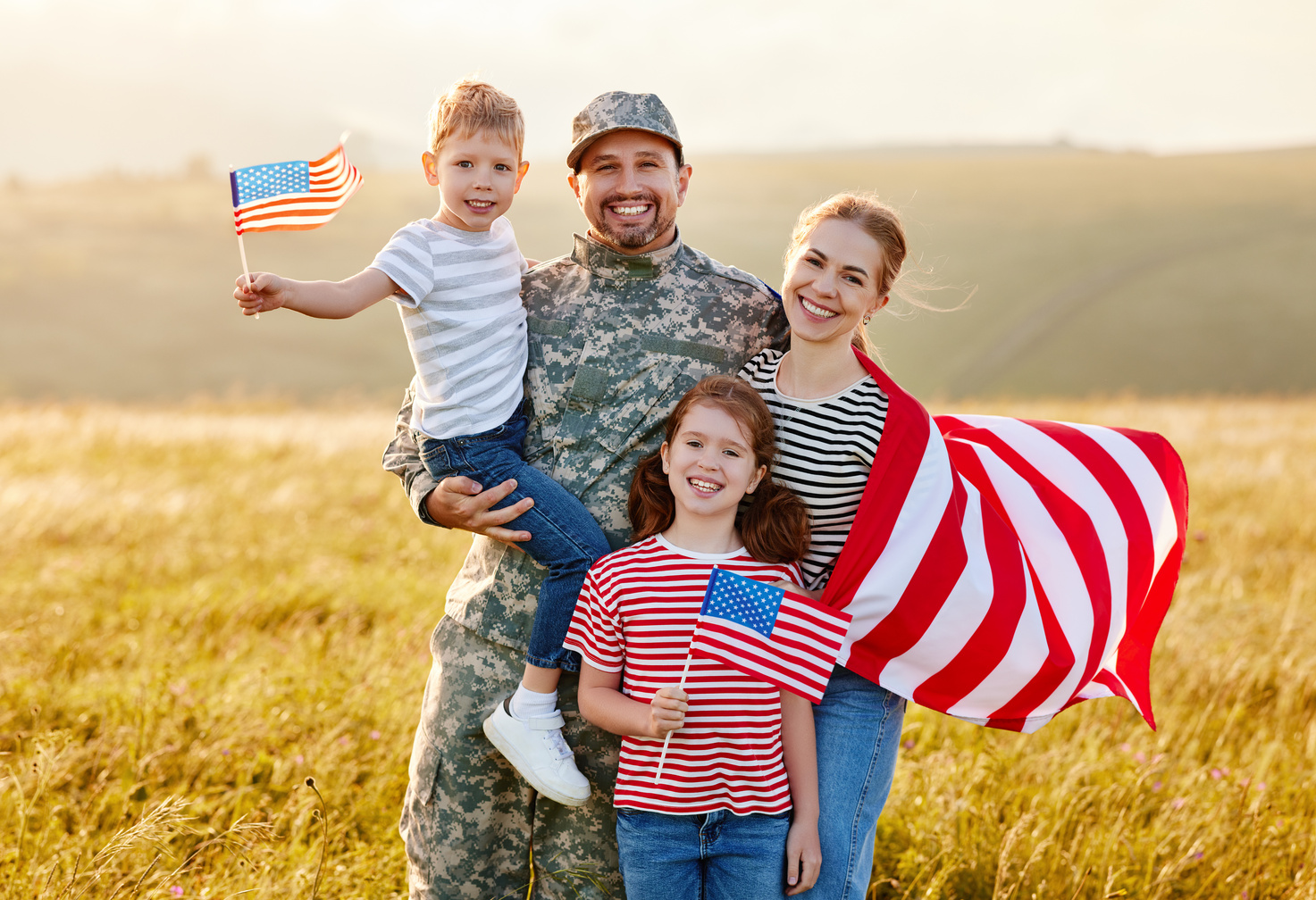 Happy man soldier reunited with his patriotic american family